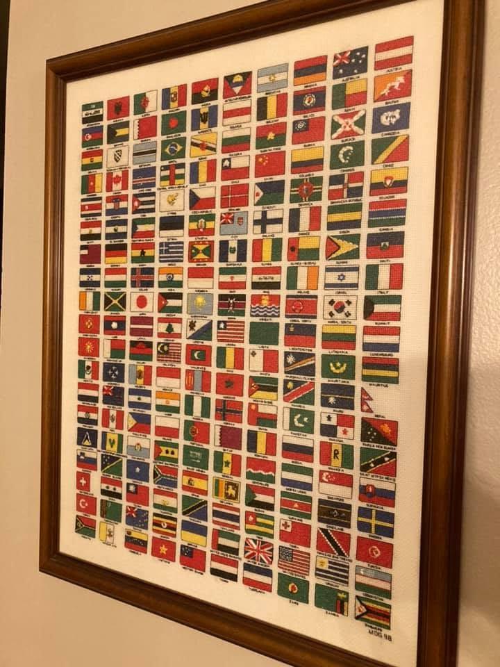 Cross-stitched flags of the world, framed