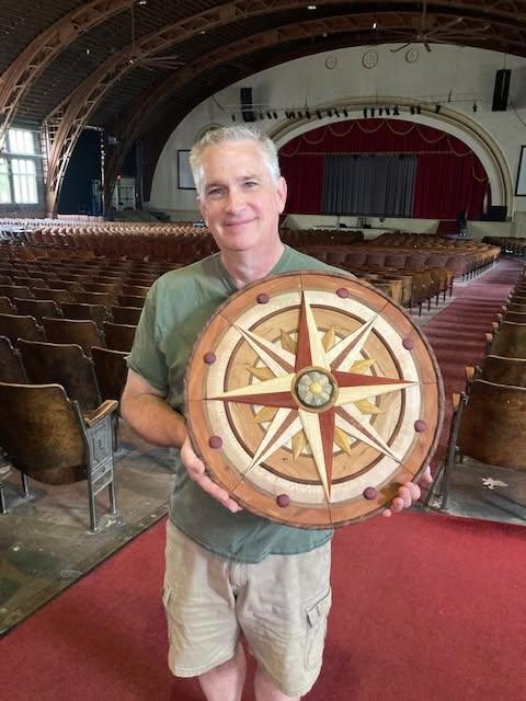 Mark Gifford holding his intarsia compass rose